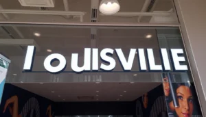 High-quality signage project by a leading sign company in Louisville showcasing custom illuminated signs with vibrant colors and professional installation for urban branding.